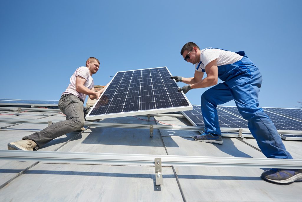 Installing solar photovoltaic panel system on roof of house